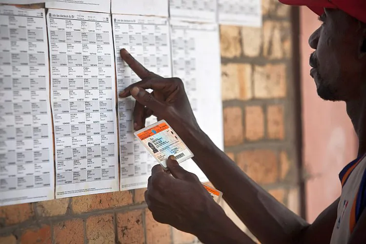 A Congolese voter looks for his name at a polling station in Kinshasa, DRC, on Nov. 24, four days ahead of national poll for president and Parliament. (Gwenn Dubourthoumieu/AFP/Getty Images)