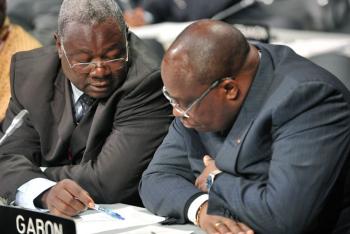 Delegation members of Gabon, Africa, talk prior a meeting at the climate summit in Copenhagen on Dec. 14. The meeting was adjourned for several hours after a walkout protest led by African countries objecting to developed countries' intention to create  (Attila Kisbenedek/AFP/Getty Images)