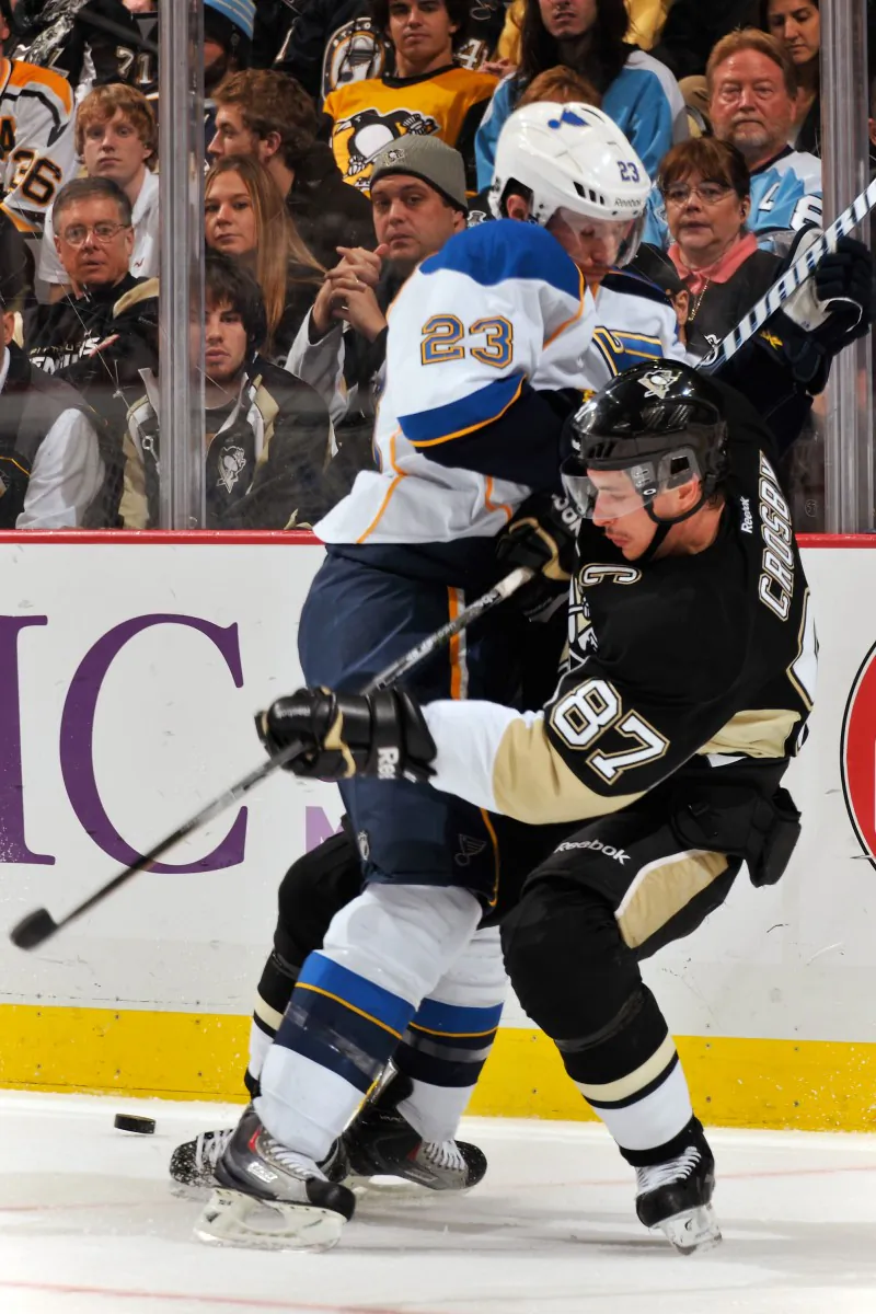 Sidney Crosby of the Pittsburgh Penguins takes a shot from Ian Cole of the St Louis Blues. Crosby is out for a second time this season with concussion symptoms. (Jamie Sabau/Getty Images)