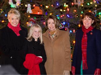HOLIDAY FESTIVITIES AT U.S. CONGRESS: The state of Arizona provided this year's Capitol Christmas Tree. From left to right: Arizona's Governor Jan Brewer, 12-year-old Kaitlyn Ferencik (representing Arizona's children), Speaker Nancy Pelosi, and Representative Ann Kirkpatrick participated Dec. 8, outside the Capitol, in the ceremony to light the tree. (Lisa Fan/The Epoch Times)