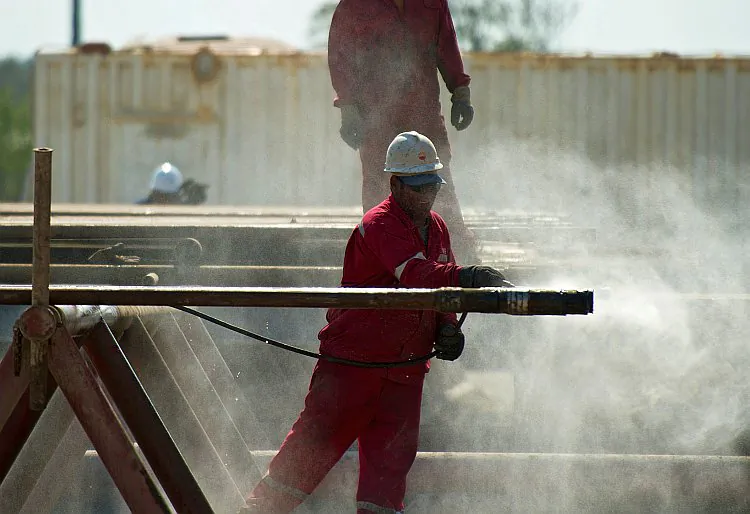 Employees work in an oil rig operated by Cuba and China, in eastern Havana in April. With Cuba's increased oil exploration and drilling in the Gulf, researchers in Florida are calling for contingency plans to be developed for coastal areas in case of an oil spill. (Adalberto Roque/AFP/Getty Images)