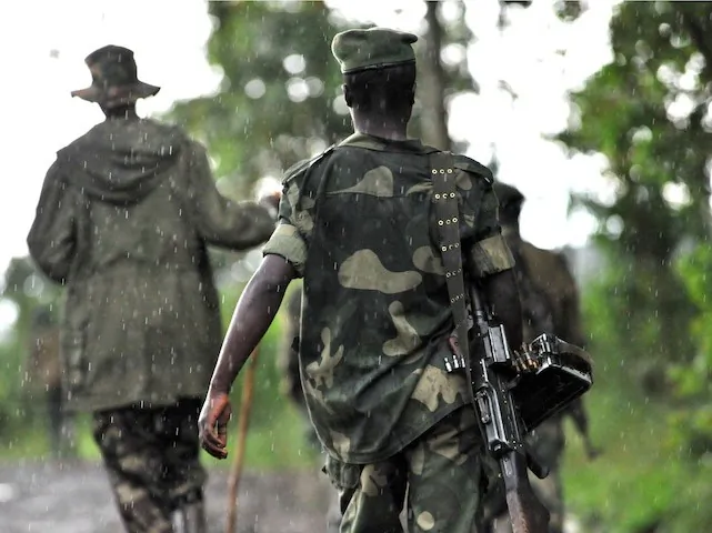 M23 rebel group soldiers patrol on Oct. 17, in Rangira, near Rutshuru, in the Democratic Republic of the Congo. In recent days, the rebels have launched attacks near Goma, the capital of North Kivu Province. (Junior D. Kannah/AFP/Getty Images)