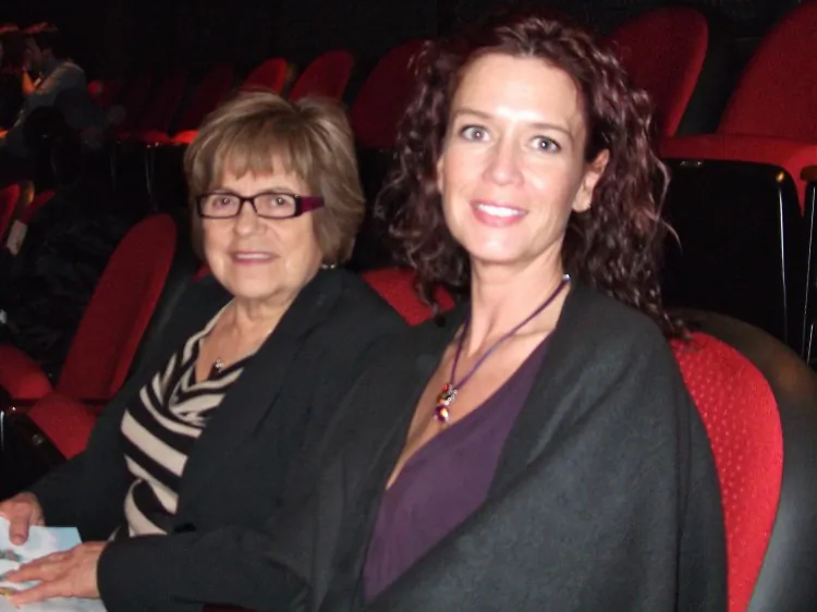 Robin Roberts (R) and her mother-in-law, Marta Zelada, attend Shen Yun Performing Arts in Regina. (Omid Ghoreishi/The Epoch Times)