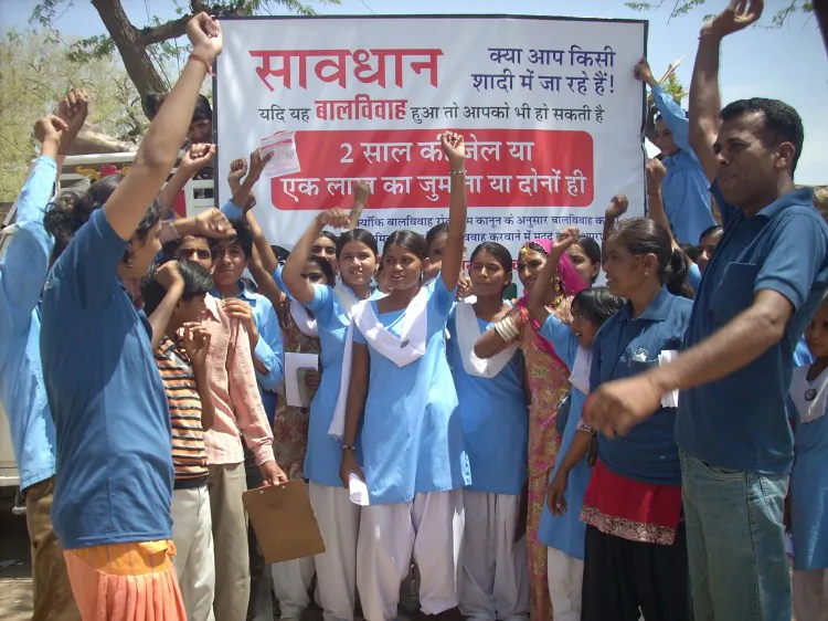 A poster from an anti-child marriage campaign in Jodhpur, Rajasthan reads, “Child marriage is against the self-respect and rights of girls. Educating girls is important for the progression of the whole community.” (Vikalp Sansthan)