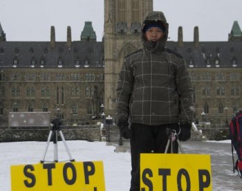 Wujun Sun comes to Parliament Hill every day to raise awareness about forced evictions and 'black jails' in China where his family home was demolished by local authorities. (Matthew Little/The Epoch Times)