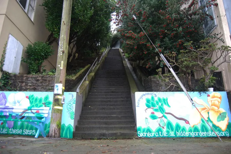 People enjoy the view from the 16th Ave. Tiled Steps, on Moraga Street in the Inner Sunset District. (Catherine Yang/The Epoch Times)