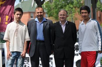 Members of Edmonton Uyghur community attending the rally. (L-R)Kurshat (Mr. Tursun's son), Kamil Tursun (correspondent of the Radio Free Asia Uyghur service), Mr. Ebrahim Ispilici, and Dilyar.(Jerry Wu/The Epoch Times)