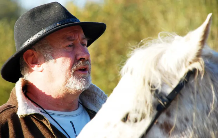 Patrick Sellier, owner of the Equinitude—Natural Western Riding club in Normandy, France, shows one of his horses. (The Epoch Times)