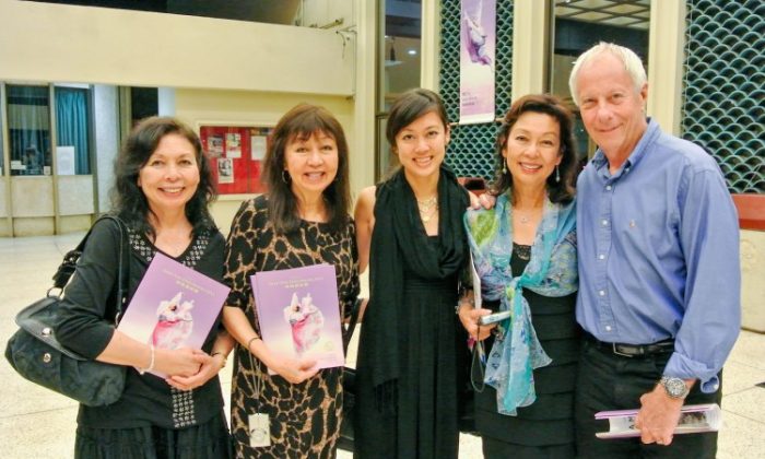 Michelle Loo, pageant entrant, (M), with her family, enjoy Shen Yun Performing Arts at Honolulu's Blaisdell Concert Hall. (Jing Qu/The Epoch Times)