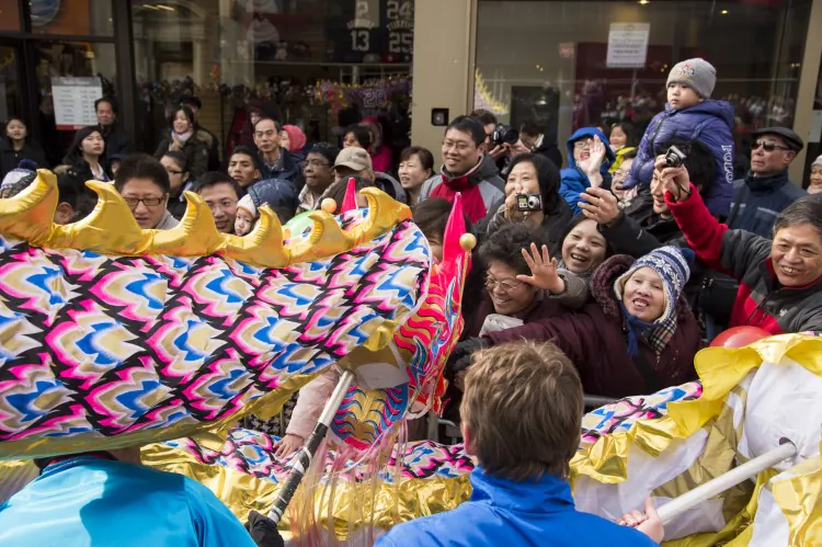 The Divine Land Marching Band entertains onlookers during the annual Chinese New Year parade in Flushing, New York, on Feb. 16. (Dai Bing/The Epoch Times)
