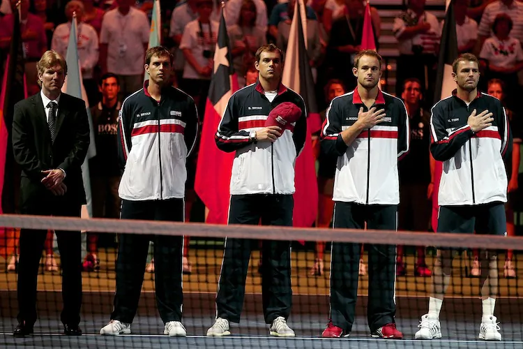 The 2011 U.S. Davis Cup team from left to right: Captain Jim Courier, Mike Bryan, Bob Bryan, Andy Roddick, and Mardy Fish. (Matthew Stockman/Getty Images)