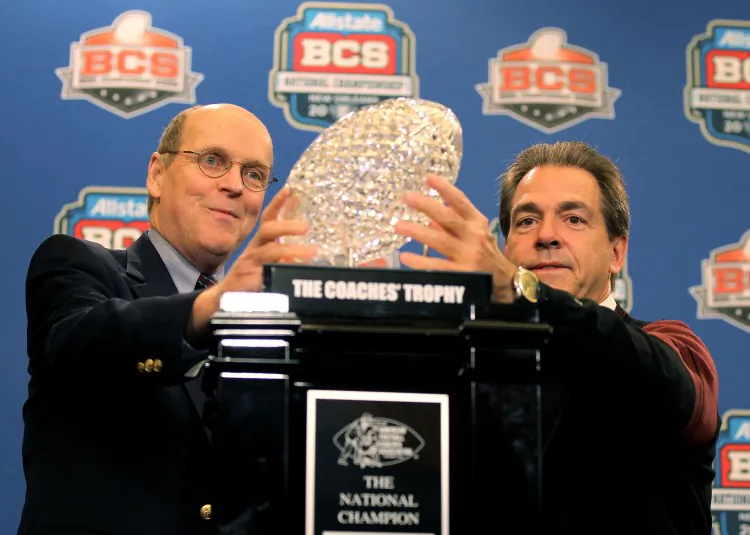 In just two years, teams coached by the likes of Nick Saban (R) will have to win a title via a playoff system. (Andy Lyons/Getty Images)