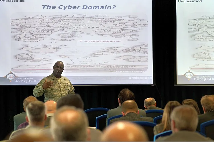 U.S. Air Force Gen. Gregory L. Brundidge (L) speaks at the Cyber Defense/Information Assurance Conference in General Rogers Conference Center on Patch Barracks in Stuttgart, Germany, in February 2011. The U.S. military is working to secure networks against cyber-attacks while developing offensive cyberwarfare capabilities. (U.S. Army photo by Martin Greeson/Released)