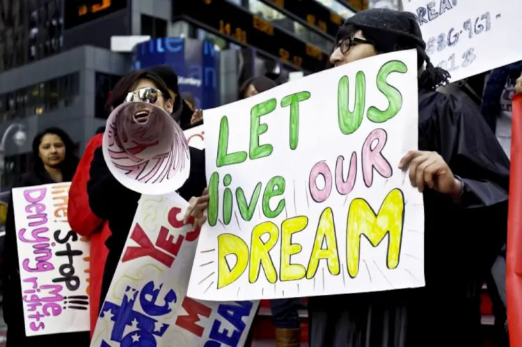 Immigrant youths show support for the DREAM Act at a rally in Times Square in November 2010. (Phoebe Zheng/The Epoch Times)