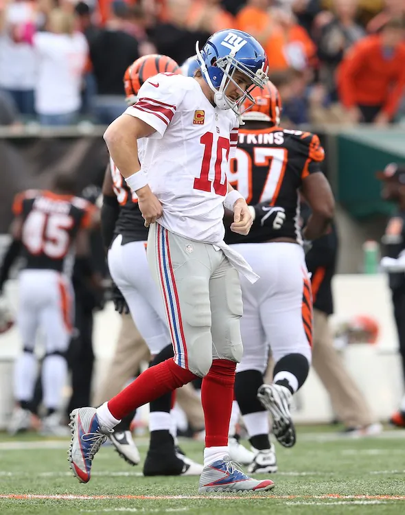 Eli Manning failed to throw a touchdown pass for the third straight game as the Giants head into their bye week with two straight losses. (Andy Lyons/Getty Images)