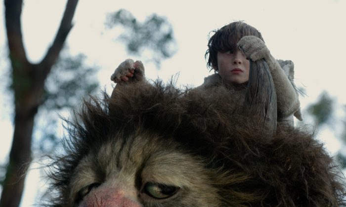 Max Records and one of the Wild Things find childhood can be tough in this loose adaptation of 'Where the Wild Things Are' (Warner Bros.)