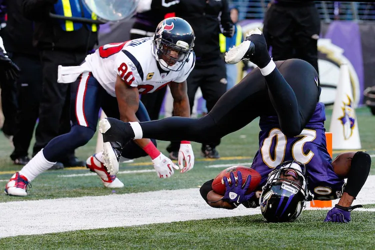 Ed Reed (20) picked off two passes against rookie quarterback T.J. Yates. (Rob Carr/Getty Images)
