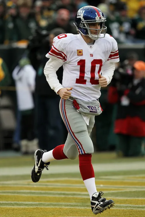 Eli Manning has started 128 straight games (including the playoffs) for the Giants. (Jonathan Daniel/Getty Images)