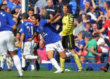 Everton's Mikel Arteta celebrates an unbelievable equalizer against Manchester United on Saturday. (Michael Regan/Getty Images)