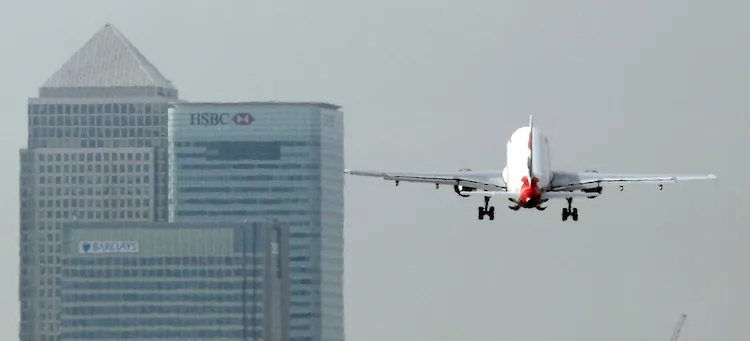 A British Airways airplane takes off from London City Airport. Starting Jan. 1, all airlines flying in or out of the European Union will have to pay for a carbon permit. (Dan Kitwood/Getty Images)