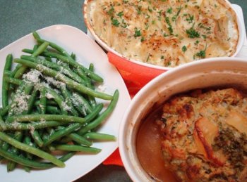 Apple stuffed roast pork, creamy Boursin scalloped potatoes, and crispy green beans. (Sandra Shields/The Epoch Times)