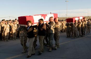 Diplomats and soldiers carrying the casket of Calgary Herald reporter Michelle Lang are followed by troops carrying the caskets of four comrades on Jan. 1, 2010. The five Canadians were slain two days earlier in Kandahar, Afghanistan. (Sgt. Gemma Bibby of the Royal Air Force, DND) Diplomats and soldiers carrying the casket of Calgary Herald reporter Michelle Lang are followed by troops carrying the caskets of four comrades on Jan. 1, 2010. The five Canadians were slain two days earlier in Kandahar, Afghanistan. (Sgt. Gemma Bibby of the Royal Air Force, DND)