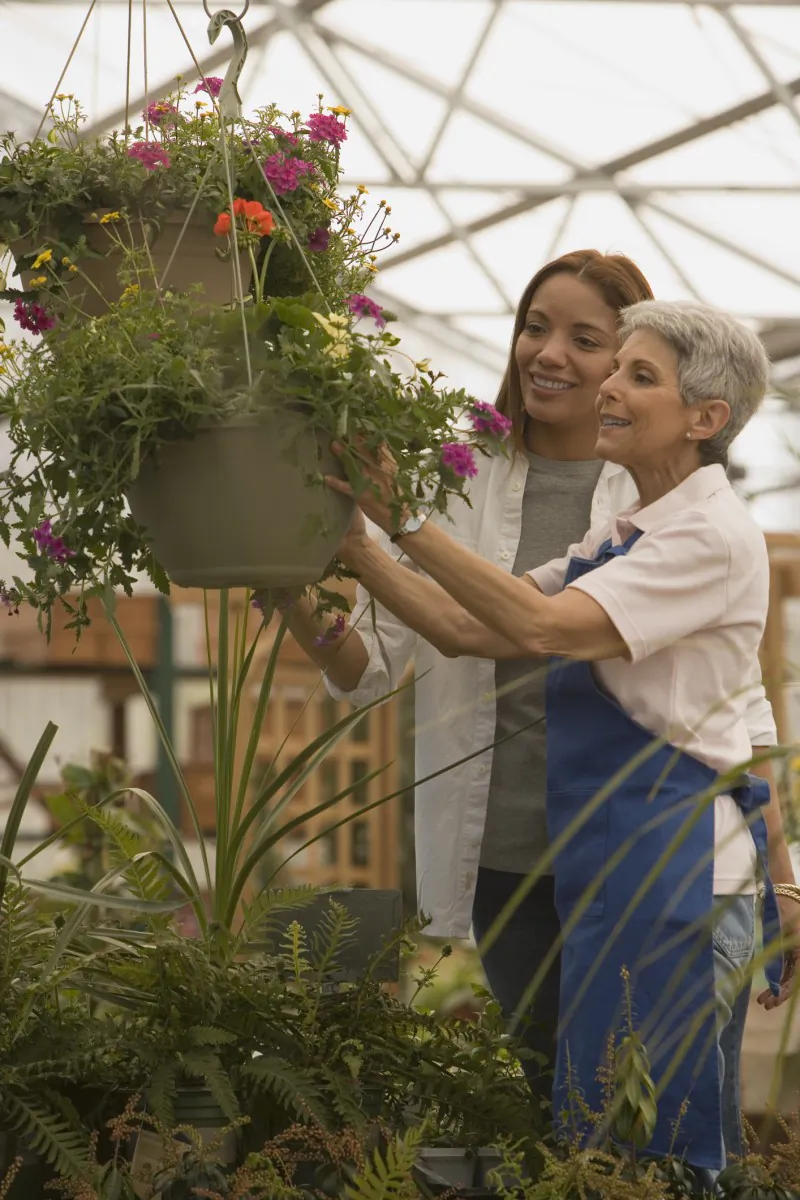 Owners of a family-run gardening business check plants in the greenhouse. Attracting a skilled workforce was the top concern for 62 percent of Canadian family businesses, according to a recent survey, which also found that over 65 percent of these businesses focus on growing domestically over globally. (Comstock Images/Photos.com)