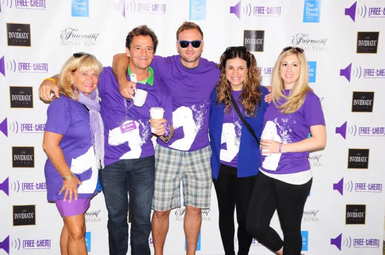 The Invidiata Team poses for a picture during the annual Free-Them Freedom Walk. From left to right is Lesley Invidiata, her husband Christopher Invidiata, Gabriel Gallucci, Maria Costa, and Rosa Viviano.Free-Them, a charity that works to raise awareness and bring an end to human trafficking, held its annual fundraiser on Sept. 15, 2012. Photograph by Mia Ismail for Everyone Is An Artist