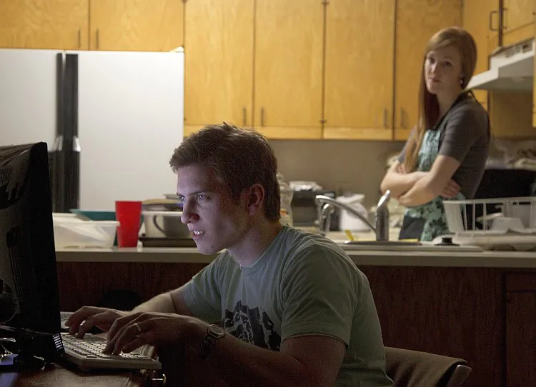 Actors pose for a photograph illustrating marriage problems caused by playing online role-playing games. (Brigham Young University)