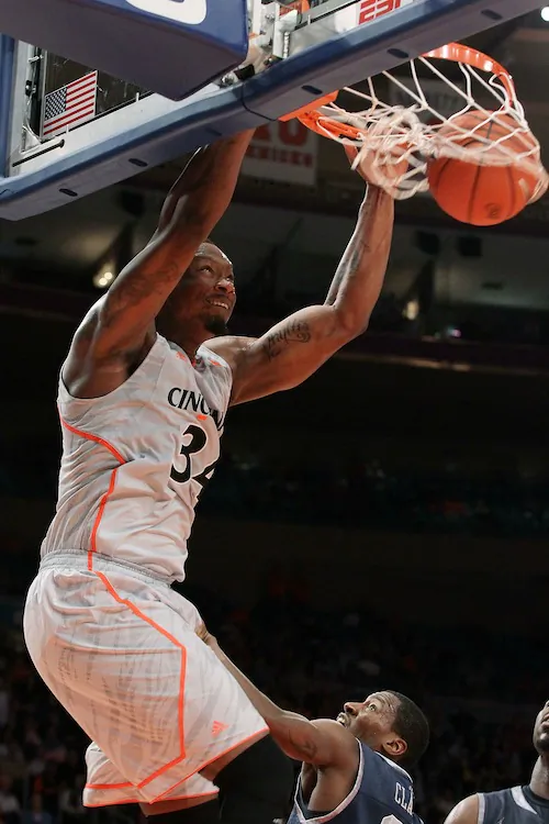 Cincinnati will be counting on a big game from Yancy Gates (dunking) to upend Ohio State. (Jim McIsaac/Getty Images)