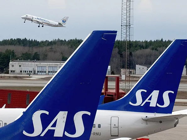Scandinavian Airline Systems (SAS) airplanes at Arlanda airport, outside Stockholm, Sweden. SAS's recent ultimatum to its employees, a measure taken to prevent bankruptcy, departed drastically from usual business practices in Sweden. (Pontus Lundahl/AFP/Getty Images)