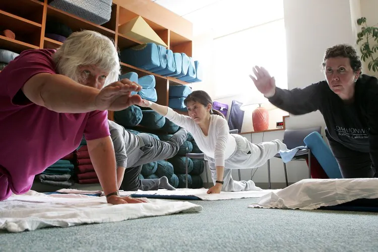 Women participate in a yoga class for cancer patients at the UCSF Comprehensive Cancer Center in San Francisco, California, US. Health professionals in the UK should encourage cancer patients to be more active, according to Macmillan Cancer Support. (Justin Sullivan/Getty Images)