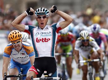 Philippe Gilbert celebrates as he crosses the finish line of Stage 19 of the Vuelta a España. (Jaime Reina/AFP/Getty Images)