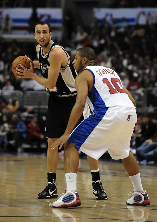 Manu Ginobli (L) will undergo surgery on his broken hand. (Harry How/Getty Images)