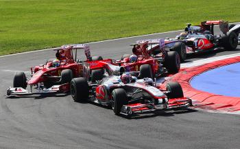 Jenson Button (Front) leads Fernando Alonso (C), Felipe Massa (L) and Lewis Hamilton (R) through the first chicane at the start of the Italian F1 Italian Grand Prix. (Mark Thompson/Getty Images) Jenson Button (Front) leads Fernando Alonso (C), Felipe Massa (L) and Lewis Hamilton (R) through the first chicane at the start of the Italian F1 Italian Grand Prix. (Mark Thompson/Getty Images)