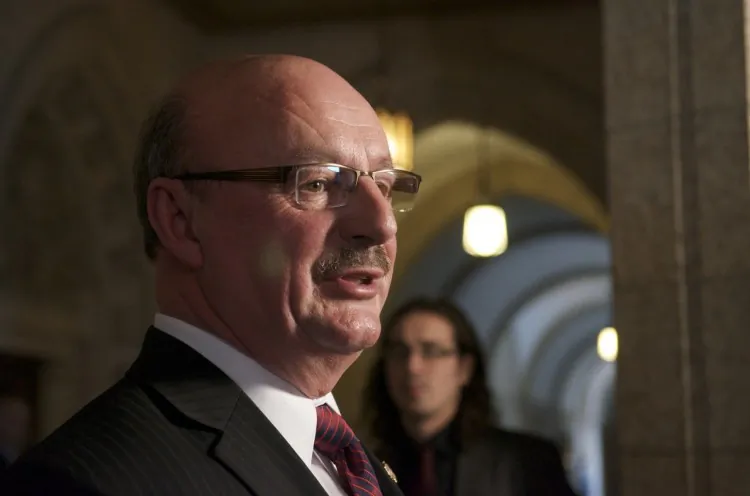 Labour critic Yvon Godin criticized Labour Minister Lisa Raitt’s back-to-work legislation in a scrum with reporters on Parliament Hill Monday. Godin said the legislation is an infringement on the rights of workers and Air Canada. (Matthew Little/The Epoch Times)