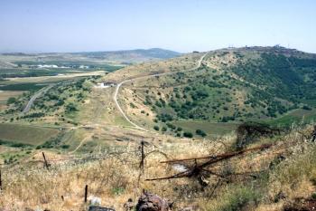 A view of the Golan near the cease-fire line with Syria, with a mine field in the foreground. (Genevieve Long/The Epoch Times)