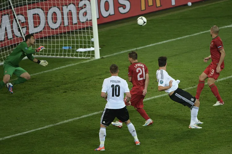 Germany’s Mario Gomez heads the ball past Portugal’s Rui Patricio at Euro 2012 on Saturday. (Anne-Christine Poujoulat/AFP/GettyImages)