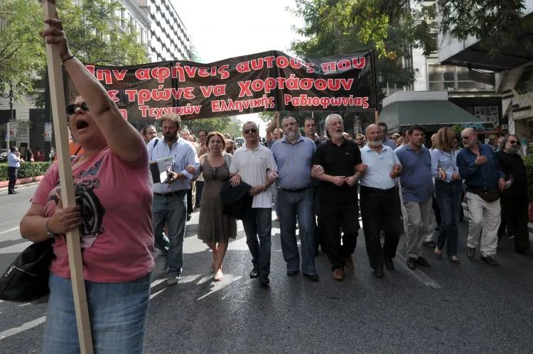 Journalists and radio-TV technicians march in central Athens during their 24-hours strike on Oct. 17, 2012. (Louisa Gouliamaki/AFP/Getty Images)