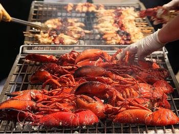 GRILLED LOBSTERS: Another way to cook lobsters is by grilling. You can still use the shell and bodies for you bisque. Be careful not to burn the shells though or this can ruin your bisque. (Oli Scarff/Getty Images)