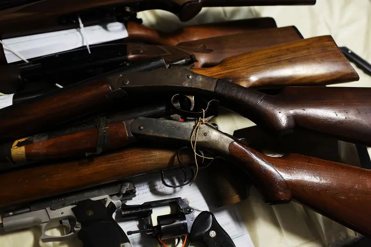 Pistols and rifles that have been turned in at a gun buy-back event in Bridgeport, Conn., on Dec. 22, 2012. A gun buy-back program in Marin County, Bay Area, on Tuesday was touted as a success, with buy-back stations running out of cash after a few hours. (Spencer Platt/Getty Images)