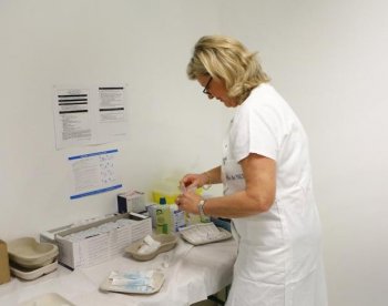 A nurse prepares a vaccine against swine flu last November in Nice, France.  (Valery Hache/Getty Images)