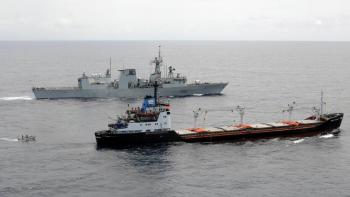 A rigid-hulled inflatable boat from HMCS Ville de Quebec ferries personnel to and from the freighter Abdul Rahman, Aug. 21, 2008. The warship is escorting the merchant vessel and her load of World Food Programme maize and soya meal from Mombasa, Kenya, to Mogadishu, Somalia, through the pirate-infested waters off East Africa. (Master Corporal Kevin Paul)