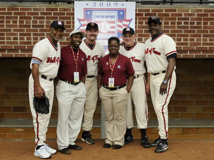 Aisha Johnson and Daniel Sampson, interns in 2009, pose with members of the National Baseball Hall of Fame. Interns spend 10 weeks working in Cooperstown, including for Hall of Fame Weekend. (Milo Stewart Jr./National Baseball Hall of Fame Library)