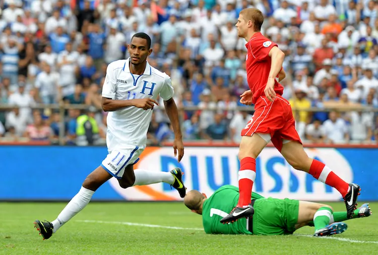 Jerry Bengtson (L) begins his celebration after scoring one of his three goals against Canada on Tuesday in World Cup 2014 qualifying in San Pedro Sula, Honduras. Honduras crushed Canada 8–1 eliminating the Canadians from World Cup qualification. (Orlando Sierra/AFP/Getty Images)