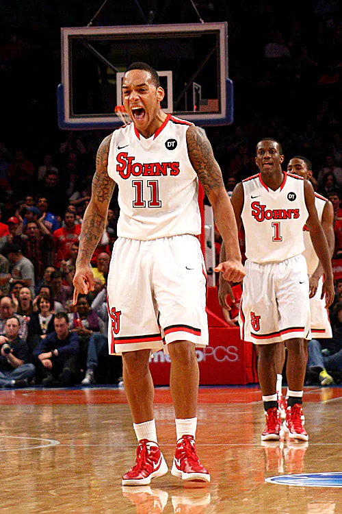 D'Angelo Harrison (11) is fired up after a big play Saturday against UCLA. (Chris Chambers/Getty Images)