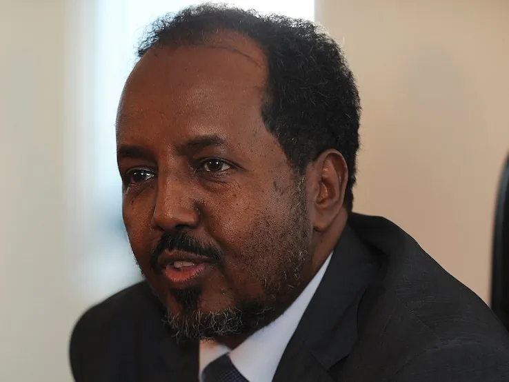 Newly elected Somali president Hassan Sheikh Mohamud speaks to the press after the first blast went off outside the Jazeera hotel on Sept. 12. Bomb blasts claimed by Islamist rebels rocked the venue of the compound in Mogadishu. (Simon Maina/AFP/GettyImages)