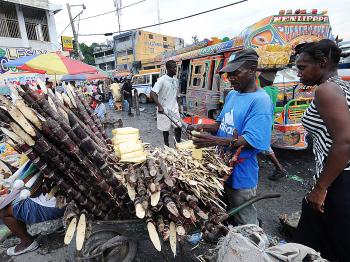 ORDER FROM CHAOS: Commerce has resumed on Dec. 13 in the commercial center of Port-au-Prince after several days of violence caused by the results of the presidential election. The outcome of the contested elections is crucial for the country that is struggling to recover from an earthquake 11 months ago. (Thony Belizaire/AFP/Getty Images)