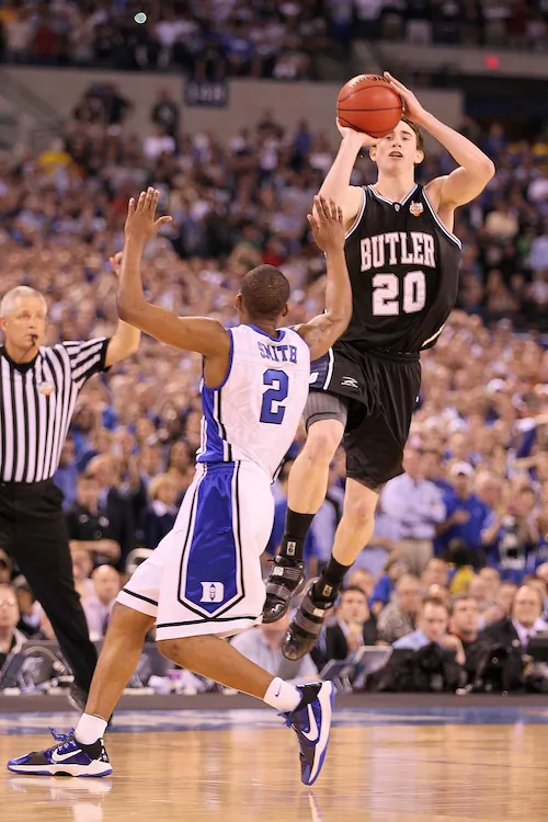 Gordon Hayward’s (R) last second half-court shot against Duke rimmed out, ending one of the most improbable tournament run in NCAA history. (Andy Lyons/Getty Images)