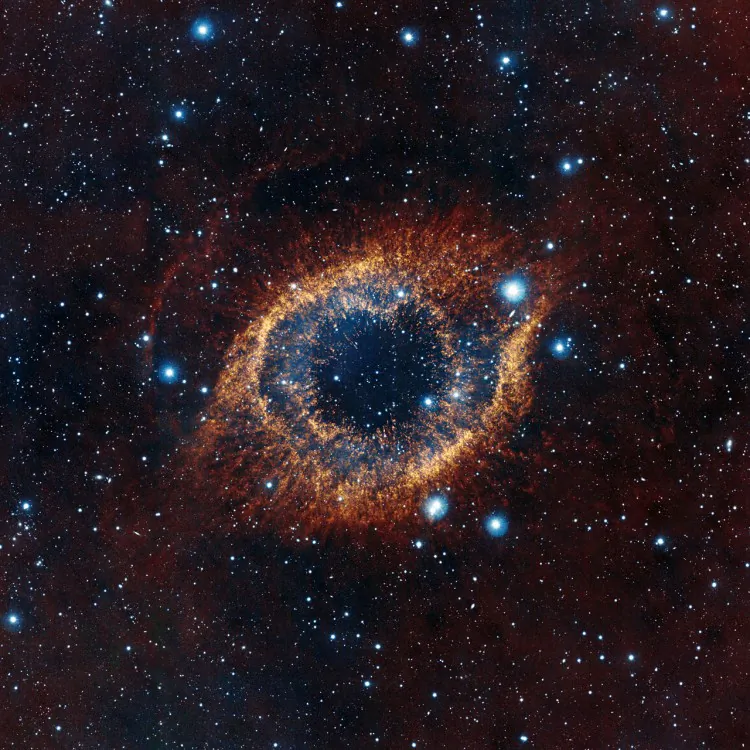 ESO’s Visible and Infrared Survey Telescope for Astronomy (VISTA) has captured this unusual view of the Helix Nebula (NGC 7293), a planetary nebula located 700 light-years away. (ESO/VISTA/J. Emerson. Acknowledgment: Cambridge Astronomical Survey Unit)